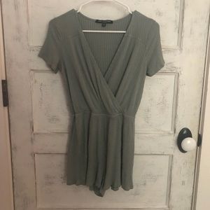 Green ribbed romper with cross top